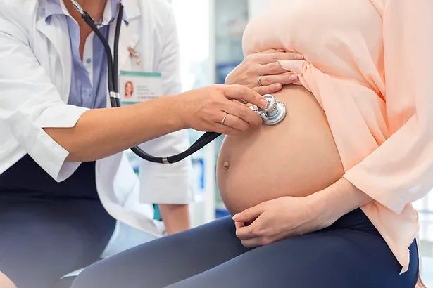 Doctor Examining Pregnant Woman